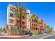 Attractive condominium building with lush palm trees enhancing the beauty of the property at 91 E Agate Ave # 204, Las Vegas, NV 89123