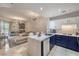 Open-concept kitchen with blue and white cabinets, complemented by a spacious living area at 91 E Agate Ave # 204, Las Vegas, NV 89123