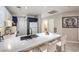 Contemporary kitchen featuring a breakfast bar, stainless appliances, and ample counter space at 91 E Agate Ave # 204, Las Vegas, NV 89123