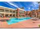 Resort-style swimming pool surrounded by lounge chairs and lush landscaping at 91 E Agate Ave # 204, Las Vegas, NV 89123