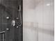 Shower features modern chrome fixtures, hand shower, and accent tile detail at 91 E Agate Ave # 204, Las Vegas, NV 89123