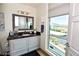 Bathroom with granite countertops, white cabinets and bright natural light at 9101 Alta Dr # 507, Las Vegas, NV 89145