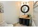 Modern bathroom with stone sink, unique mirror and plenty of light at 9101 Alta Dr # 507, Las Vegas, NV 89145