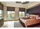 Bright bedroom featuring a large window with views, and a luxurious bed with many pillows at 9101 Alta Dr # 507, Las Vegas, NV 89145