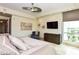 Bedroom with an eye-catching ceiling fan, flat screen TV, and a large window showcasing the cityscape at 9101 Alta Dr # 507, Las Vegas, NV 89145