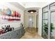Elegant foyer features marble floors, custom lighting, and a statement art piece at 9101 Alta Dr # 507, Las Vegas, NV 89145