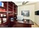 Home office with custom wood built-ins, a large desk, and ample storage space at 9101 Alta Dr # 507, Las Vegas, NV 89145