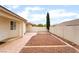 View of the cozy backyard with a neutral color scheme and low-maintenance landscaping at 9289 Mandeville Bay Ave, Las Vegas, NV 89148