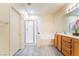 Bright bathroom with shower, tub, neutral paint, wood cabinets, and gray tile flooring at 9289 Mandeville Bay Ave, Las Vegas, NV 89148