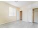 Bedroom with closet, window, tile floor and neutral colored walls at 9289 Mandeville Bay Ave, Las Vegas, NV 89148