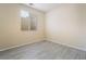Inviting bedroom with tile flooring, neutral paint, and a bright window, creating a serene and comfortable retreat at 9289 Mandeville Bay Ave, Las Vegas, NV 89148