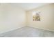 Bedroom with tile flooring, neutral walls, and natural light from the window at 9289 Mandeville Bay Ave, Las Vegas, NV 89148