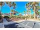 Landscaped common area with palm trees, accessible parking and well-maintained grounds at 9289 Mandeville Bay Ave, Las Vegas, NV 89148