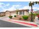 Charming home with a two-car garage, desert landscaping, and a well-maintained yard offers excellent curb appeal at 9289 Mandeville Bay Ave, Las Vegas, NV 89148