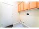 Laundry room with overhead cabinets and tile flooring at 9289 Mandeville Bay Ave, Las Vegas, NV 89148