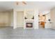 Open living room features a fireplace and tile flooring throughout the entire home at 9289 Mandeville Bay Ave, Las Vegas, NV 89148