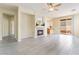 Inviting living room features tile flooring, a cozy fireplace, and sliding glass doors that opens to outdoor space at 9289 Mandeville Bay Ave, Las Vegas, NV 89148
