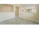 Open-concept living room featuring tile floors, neutral paint, and natural light, creating a warm and inviting space at 9289 Mandeville Bay Ave, Las Vegas, NV 89148