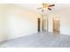Spacious main bedroom with neutral paint colors, tile floors, and access to the ensuite at 9289 Mandeville Bay Ave, Las Vegas, NV 89148