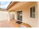 Covered patio area with sliding glass door access, offering a seamless indoor-outdoor flow at 9289 Mandeville Bay Ave, Las Vegas, NV 89148