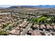 This aerial shows a well-planned community offering beautiful homes near green spaces and mountain views at 936 Viscanio Pl, Las Vegas, NV 89138