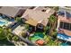 An aerial view showcasing the property's layout, pool, landscaping, and proximity to neighboring homes at 936 Viscanio Pl, Las Vegas, NV 89138