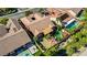 Aerial view of backyard pool and outdoor patio, with neighboring rooftops at 936 Viscanio Pl, Las Vegas, NV 89138