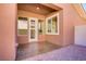 The covered back patio has ample natural light, a textured concrete floor, and easy access to the yard at 936 Viscanio Pl, Las Vegas, NV 89138