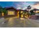 A serene backyard featuring desert landscaping, a built-in barbecue area, and a spacious patio at 936 Viscanio Pl, Las Vegas, NV 89138