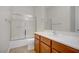Well-appointed bathroom featuring a combined shower and tub with glass doors plus a single sink vanity at 936 Viscanio Pl, Las Vegas, NV 89138