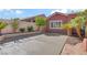 Wide driveway leading to a well-maintained home with mature landscaping at 936 Viscanio Pl, Las Vegas, NV 89138