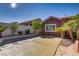 Side of house view features a driveway, landscaping and a home with neutral stucco at 936 Viscanio Pl, Las Vegas, NV 89138