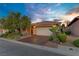 Charming single-story home with manicured landscaping, a two-car garage, and an inviting entrance at 936 Viscanio Pl, Las Vegas, NV 89138