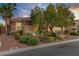 Attractive single-story home with stone accents, a two-car garage, and well-maintained landscaping at 936 Viscanio Pl, Las Vegas, NV 89138