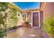 Welcoming front entrance with decorative stone walkway and well-maintained landscaping around the front door at 936 Viscanio Pl, Las Vegas, NV 89138