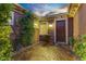 Inviting front porch with a decorative door, a small garden, and a welcoming entryway at 936 Viscanio Pl, Las Vegas, NV 89138