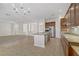 Bright, open kitchen with granite counters, stainless steel appliances, and adjacent living area at 936 Viscanio Pl, Las Vegas, NV 89138