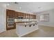 Modern kitchen featuring granite countertops, stainless steel appliances, and ample cabinet space at 936 Viscanio Pl, Las Vegas, NV 89138
