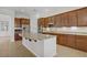 Well-equipped kitchen featuring stainless steel appliances, granite countertops, and a large island with seating at 936 Viscanio Pl, Las Vegas, NV 89138