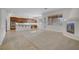 Open-concept living space with a fireplace, tile flooring, and access to the kitchen area at 936 Viscanio Pl, Las Vegas, NV 89138