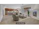 Open concept living space with fireplace, tile flooring, and seamless access to the kitchen and dining areas at 936 Viscanio Pl, Las Vegas, NV 89138