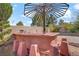 Outdoor kitchen with grill, sink, and seating area, perfect for entertaining at 936 Viscanio Pl, Las Vegas, NV 89138