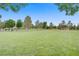 Expansive green park with mature trees and benches, perfect for relaxation and outdoor activities at 936 Viscanio Pl, Las Vegas, NV 89138