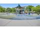 Community playground featuring swings, slides, and play structures under a shaded canopy at 936 Viscanio Pl, Las Vegas, NV 89138