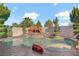 Inviting pool with a rock waterfall feature, creating a serene backyard oasis at 936 Viscanio Pl, Las Vegas, NV 89138