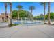 Community splash pad invites to enjoy playful water features amid palm trees, near shaded seating and play areas at 936 Viscanio Pl, Las Vegas, NV 89138