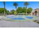 Community splash pad with water features, palm trees, and shaded seating areas at 936 Viscanio Pl, Las Vegas, NV 89138