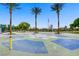 Community splash pad with active water jets provides a playful escape with surrounding palm trees and open green spaces at 936 Viscanio Pl, Las Vegas, NV 89138