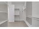 Bright, expansive walk-in closet with shelving, hanging rods, and adjacent access to the bedroom and bathroom at 936 Viscanio Pl, Las Vegas, NV 89138