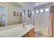 Bright bathroom featuring a single sink vanity, bathtub with shower, and decorative wall art at 9524 Tyler Rose St, Las Vegas, NV 89178